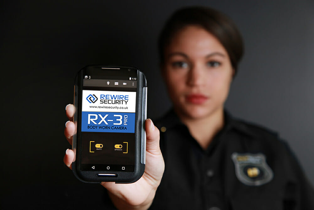 Security Officer Holding a Body-Worn Camera