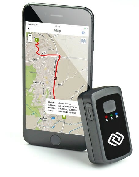 SpyTrack Nano Next to a Smartphone